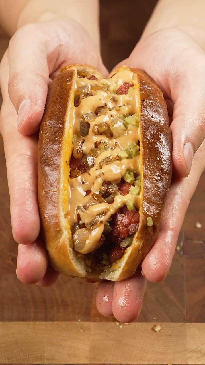 Homemade Hot Dog Sandwich with Caramelized Onions and Melted Cheddar