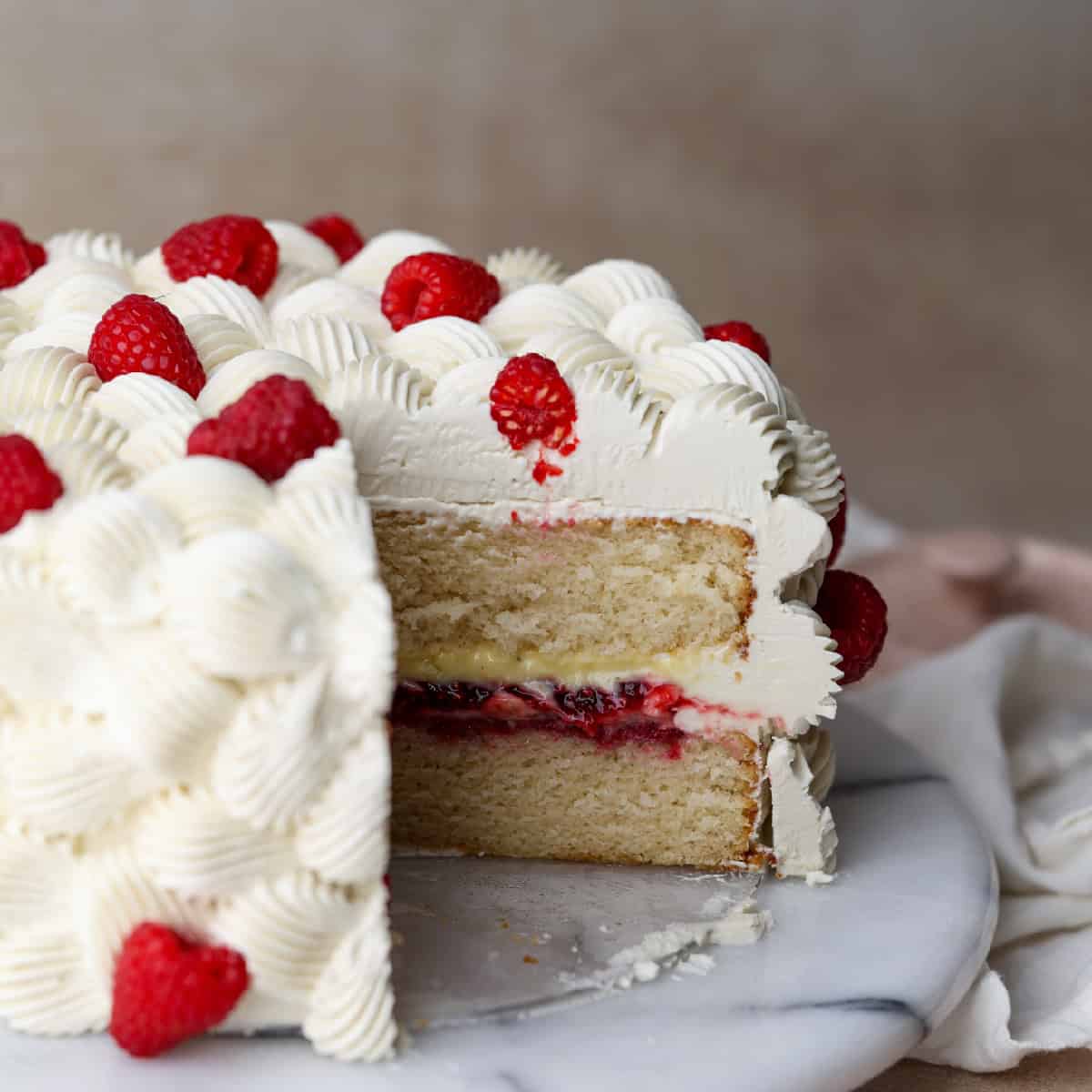 White Cake with Raspberry Filling and Buttercream Frosting